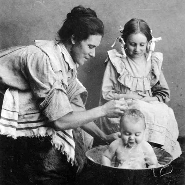 Baby Evangeline being bathed by her mother [B 56385] 